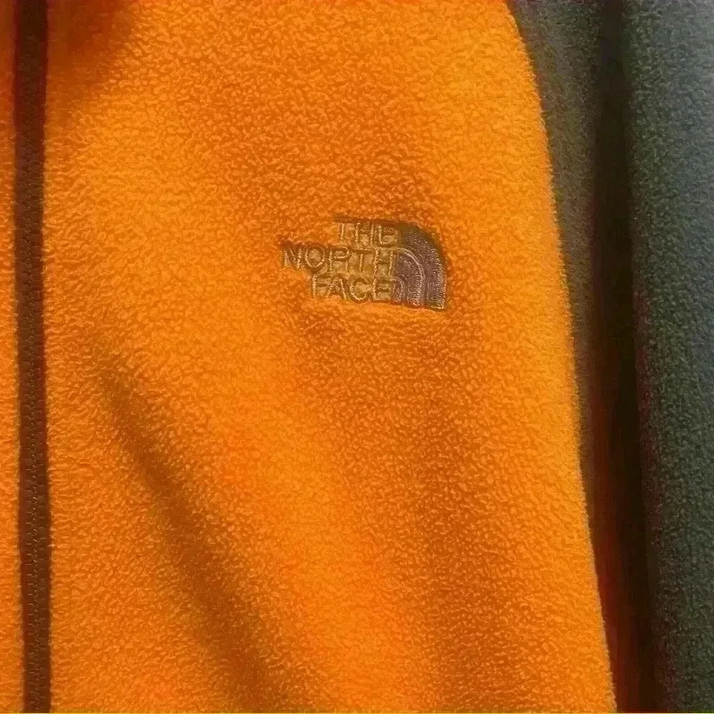 The North Face - orange and gray fleece jacket